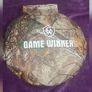 Game Winner Round Camouflaged Seat Cushion with black carrying handle.